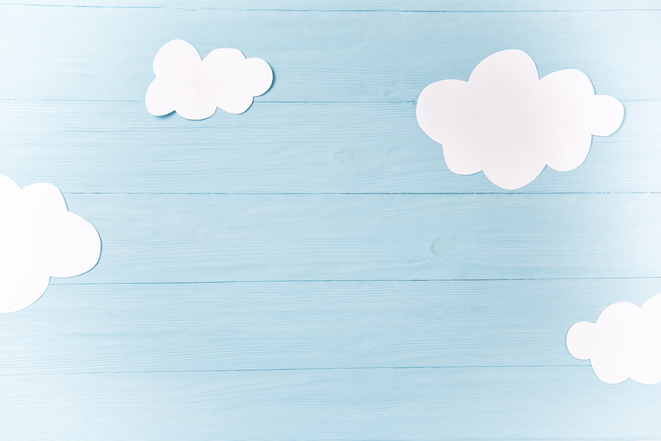 Baby boy background, white clouds on the blue wooden background
